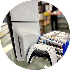 PlayStation 5 console with DualSense controller and PS5 games on display